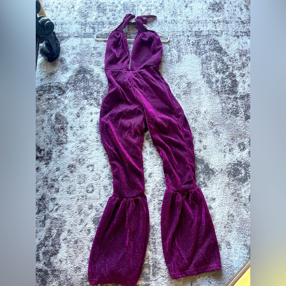 Selena costume with brunette wig with bangs.